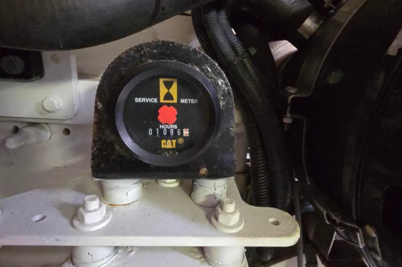 Slide: The Image of Engine service meter showing 1096 hours on a 2003 Riviera 48 Flybridge. - 14