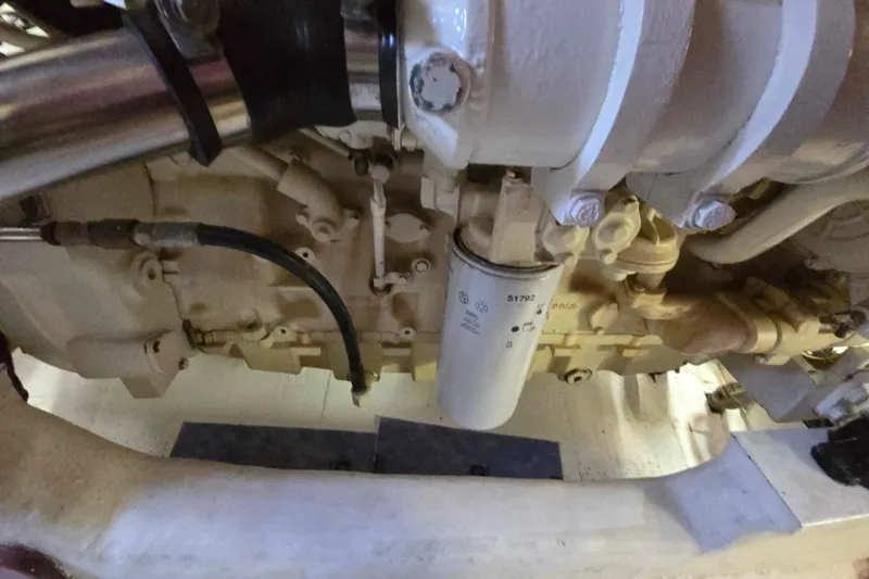 Slide: The Image of Engine compartment of a 2003 Riviera 48 Flybridge yacht, showcasing mechanical components. - 15