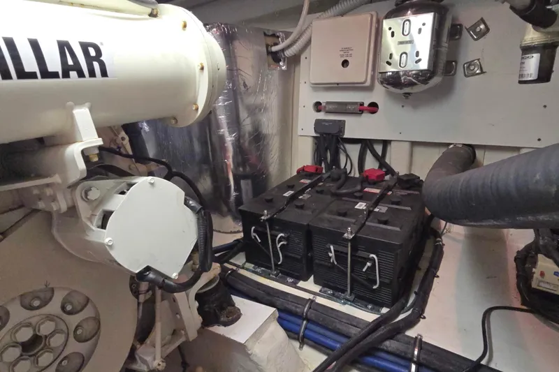 Slide: The Image of Engine room of 2003 Riviera 48 Flybridge with batteries and mechanical components. - 18