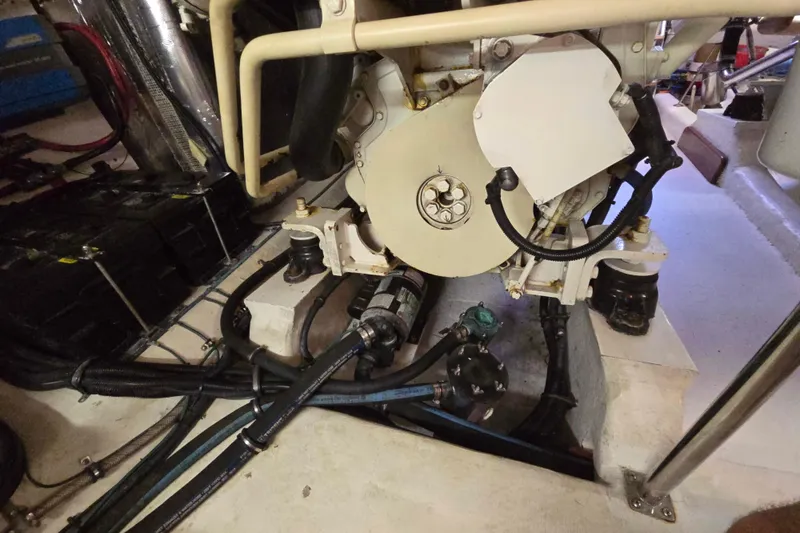 Slide: The Image of Engine room of 2003 Riviera 48 Flybridge with visible mechanical components and wiring. - 20