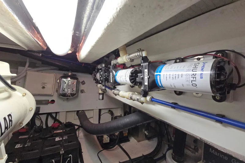 Slide: The Image of Engine room of 2003 Riviera 48 Flybridge with Shurflo water pump system. - 22