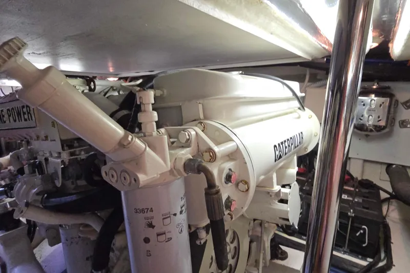 Slide: The Image of Engine room of 2003 Riviera 48 Flybridge with Caterpillar engine components. - 25