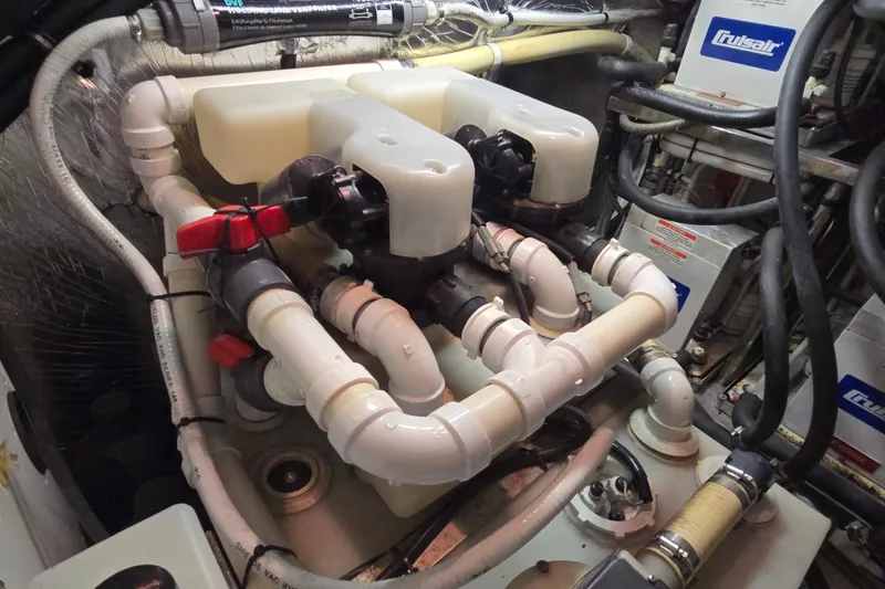 Slide: The Image of Engine room of 2003 Riviera 48 Flybridge with complex piping system. - 27