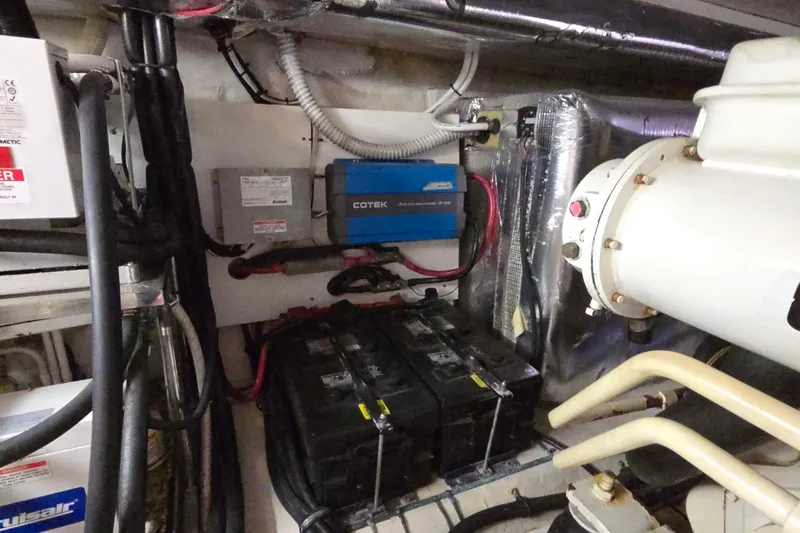 Slide: The Image of Engine room of 2003 Riviera 48 Flybridge with batteries and electrical components. - 28