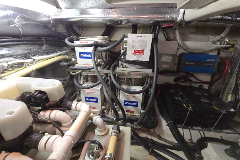Slide: The Image of Engine room of 2003 Riviera 48 Flybridge with mechanical and electrical components. - 29