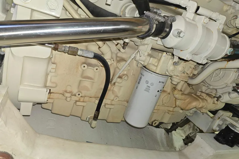 Slide: The Image of Engine compartment of a 2003 Riviera 48 Flybridge yacht, showcasing mechanical components. - 30