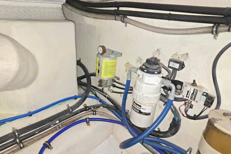 Slide: The Image of Engine room of 2003 Riviera 48 Flybridge with fuel filtration system and wiring. - 31