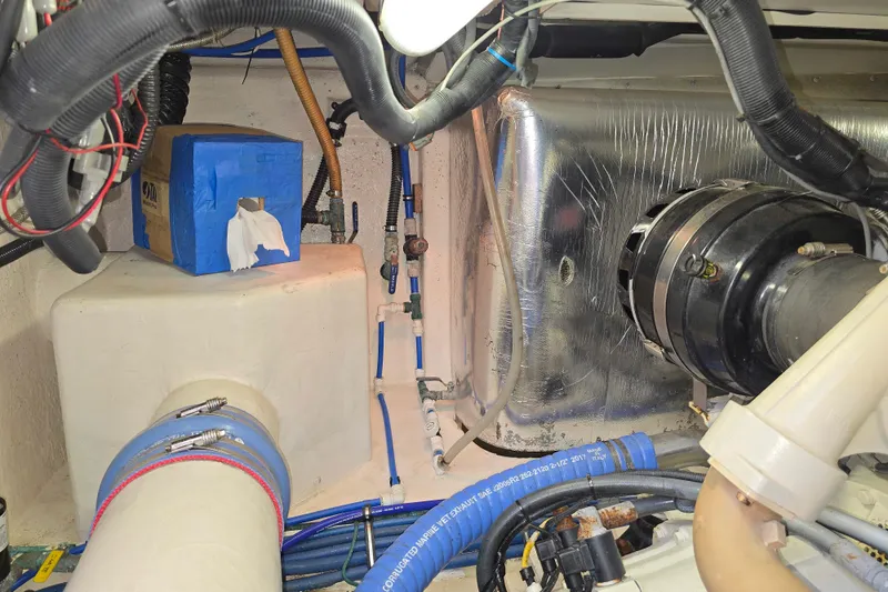 Slide: The Image of Engine room of 2003 Riviera 48 Flybridge with visible wiring and components. - 34