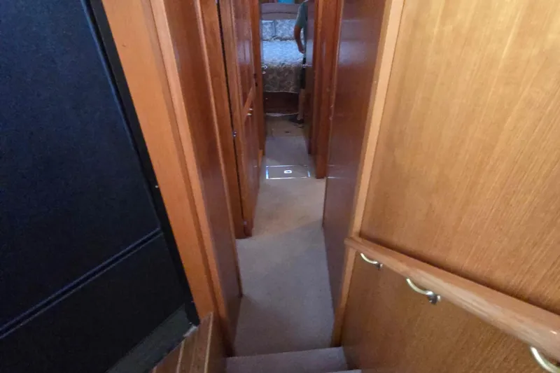 Slide: The Image of Interior hallway of 2003 Riviera 48 Flybridge yacht with wooden paneling. - 36