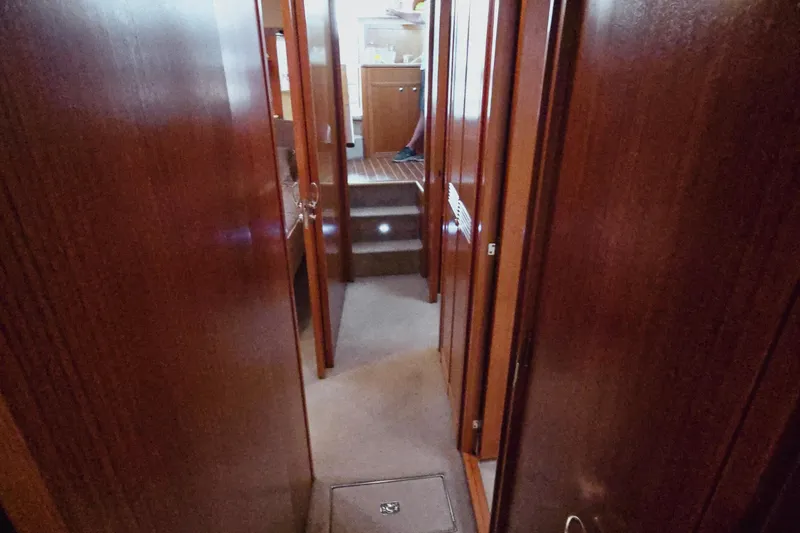 Slide: The Image of Interior hallway of 2003 Riviera 48 Flybridge yacht with wooden finishes. - 39