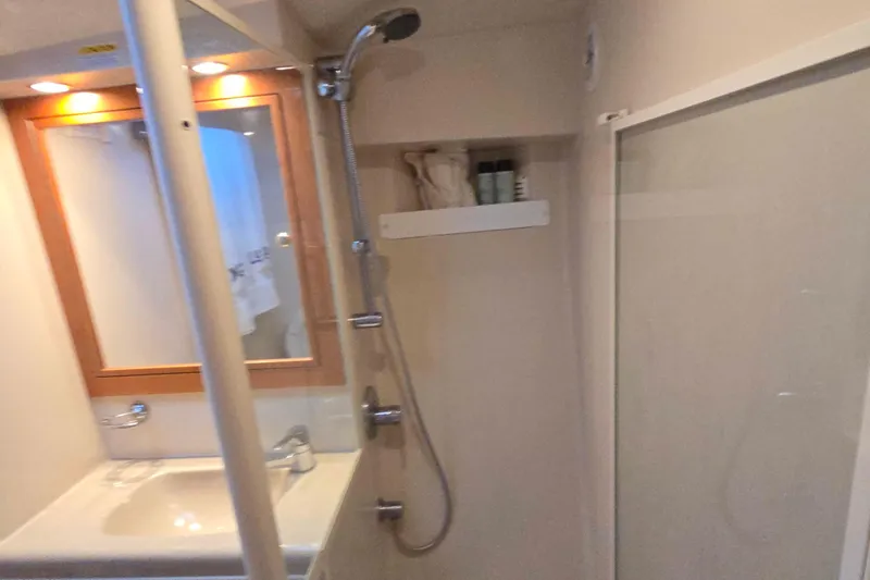 Slide: The Image of Bathroom interior of 2003 Riviera 48 Flybridge yacht with shower and sink. - 50