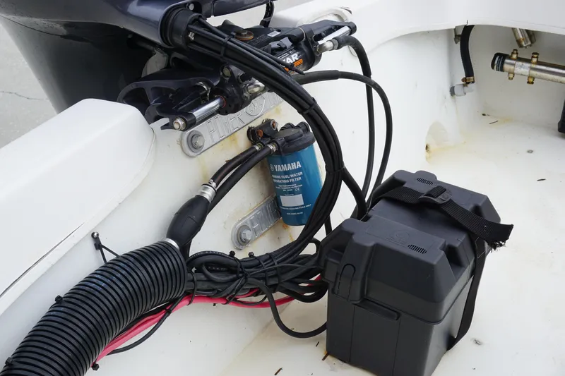 Slide: The Image of 2005 Twin Vee 19 boat engine compartment with Yamaha fuel filter and battery box. - 14
