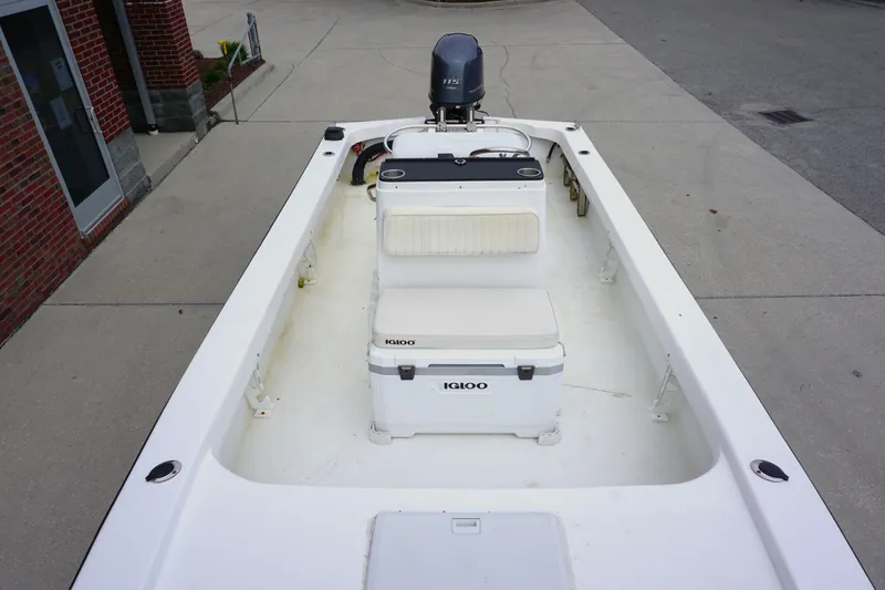 Slide: The Image of 2005 Twin Vee 19 boat interior with Igloo cooler and outboard motor. - 5