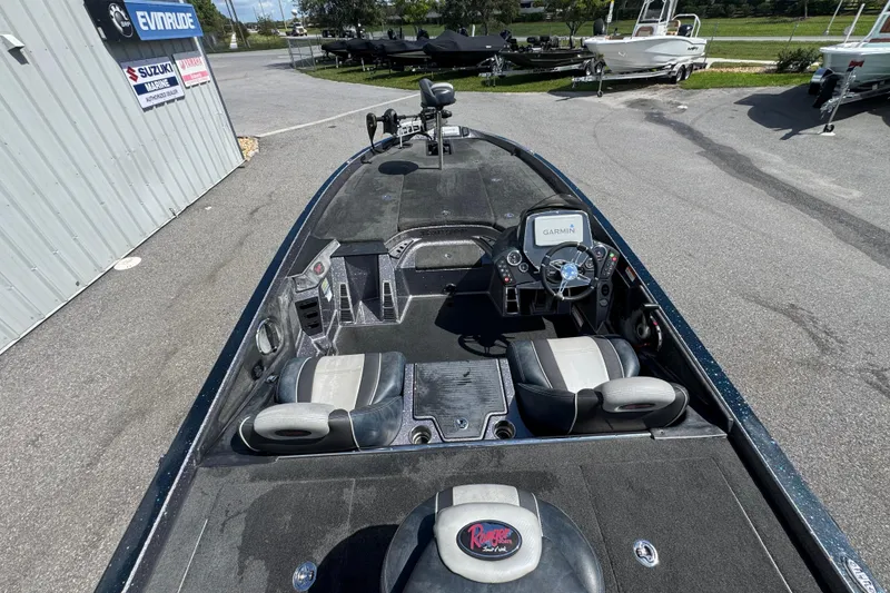 Slide: The Image of 2014 Ranger 520C boat interior with Garmin navigation system, parked near dealership. - 11