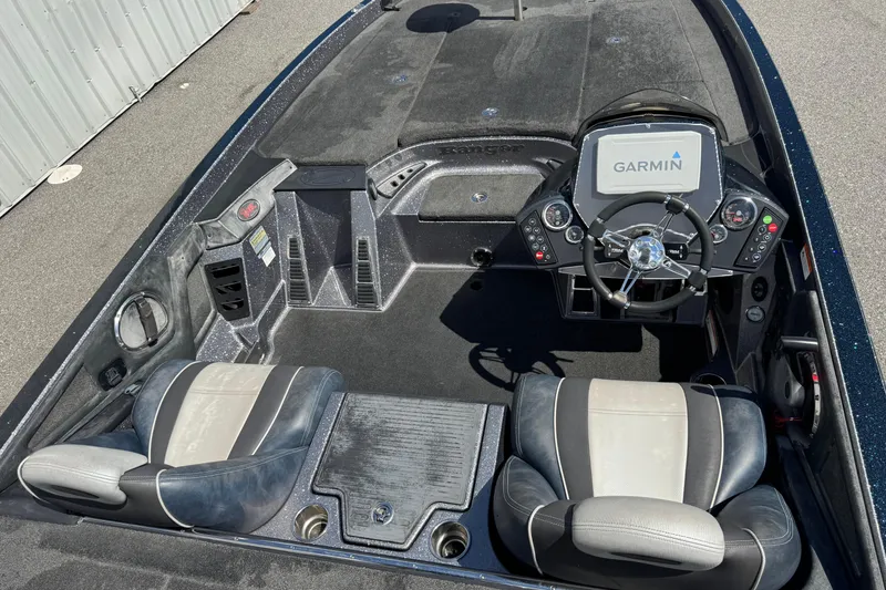 Slide: The Image of 2014 Ranger 520C boat interior with Garmin navigation system and dual seats. - 12