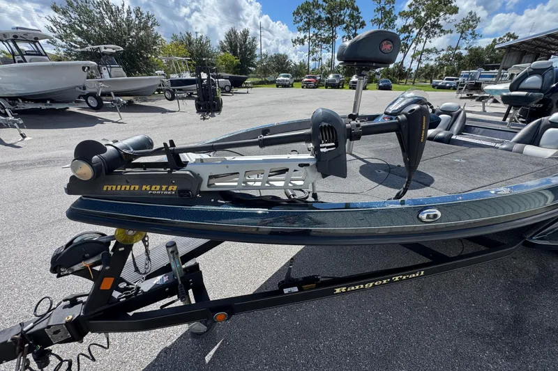 Slide: The Image of 2014 Ranger 520C boat with Minn Kota trolling motor in a parking lot. - 4