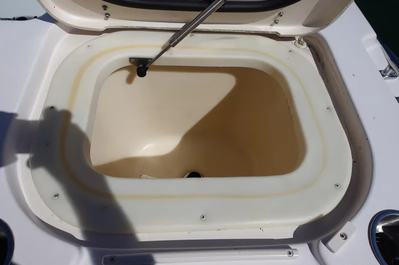 Slide: The Image of Open storage compartment on 2002 Grady White 300 Marlin boat. - 18