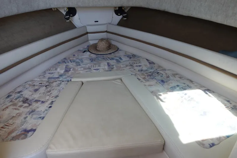 Slide: The Image of Interior cabin of 2002 Grady White 300 Marlin boat with patterned bedding. - 22