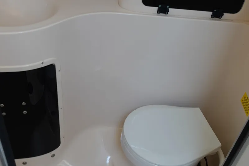 Slide: The Image of 2002 Grady White 300 Marlin boat interior with compact marine toilet. - 25