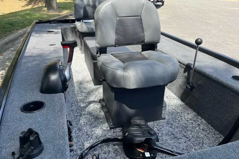 Slide: The Image of 2025 Tracker Panfish 17 boat interior with gray seating and control panel. - 7