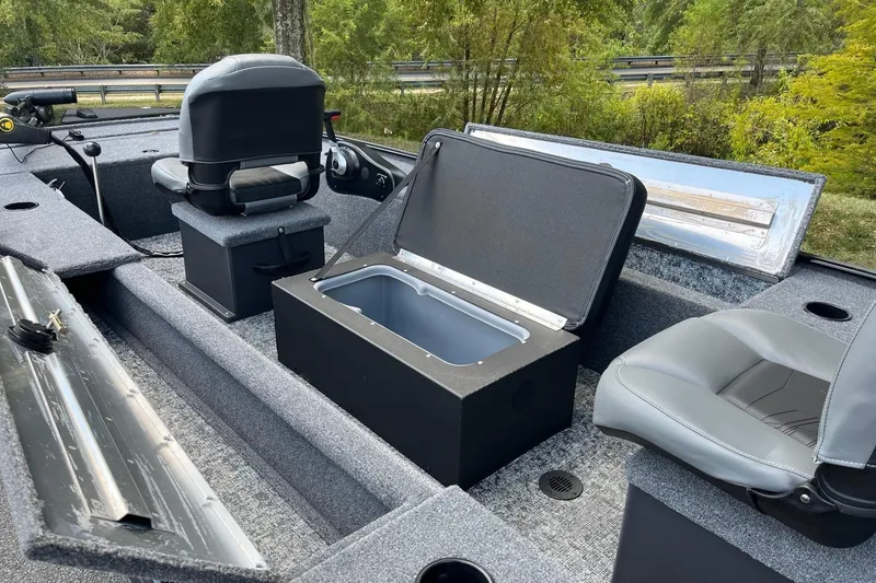 Slide: The Image of 2025 Tracker Panfish 17 boat interior with seating and storage compartments. - 8