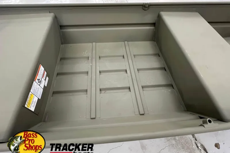 Slide: The Image of 2026 Tracker Grizzly 14 Jon boat interior with Bass Pro Shops logo. - 3