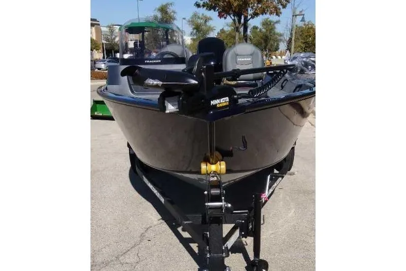 Slide: The Image of 2026 Tracker Pro Guide V-16 SC boat on trailer, featuring Minn Kota trolling motor. - 4