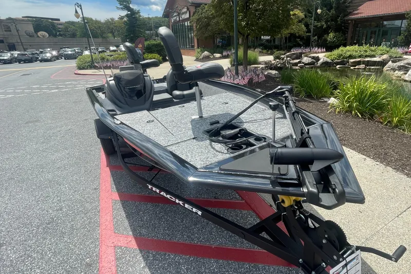 Slide: The Image of 2026 Tracker Pro Team 175 boat with Mercury 50 engine, parked outdoors. - 2