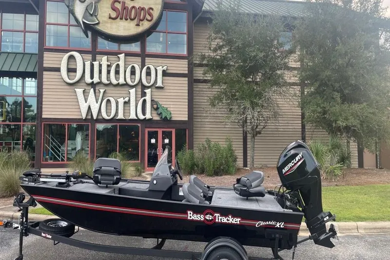 Slide: The Image of 2026 Tracker Bass Tracker Classic XL boat outside Outdoor World store. - 4