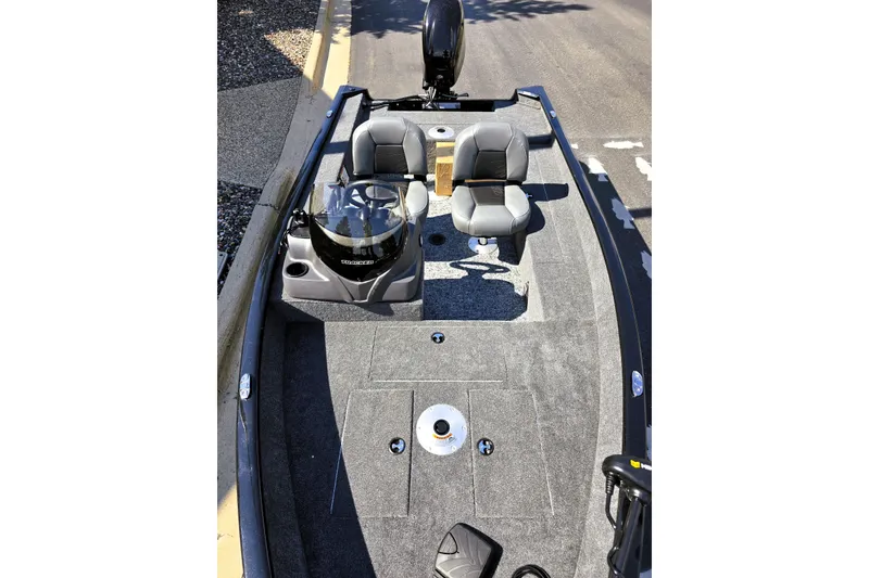 Slide: The Image of 2026 Tracker Super Guide V-16 SC fishing boat with dual seats and steering console. - 2