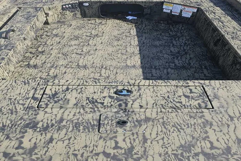 Slide: The Image of 2026 Tracker Grizzly 1654 T Sportsman boat interior with camouflage pattern. - 4