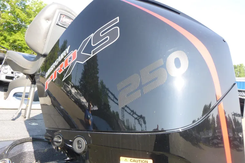 Slide: The Image of 2024 Ranger 212LS boat with Mercury Pro XS 250 engine, close-up view. - 12
