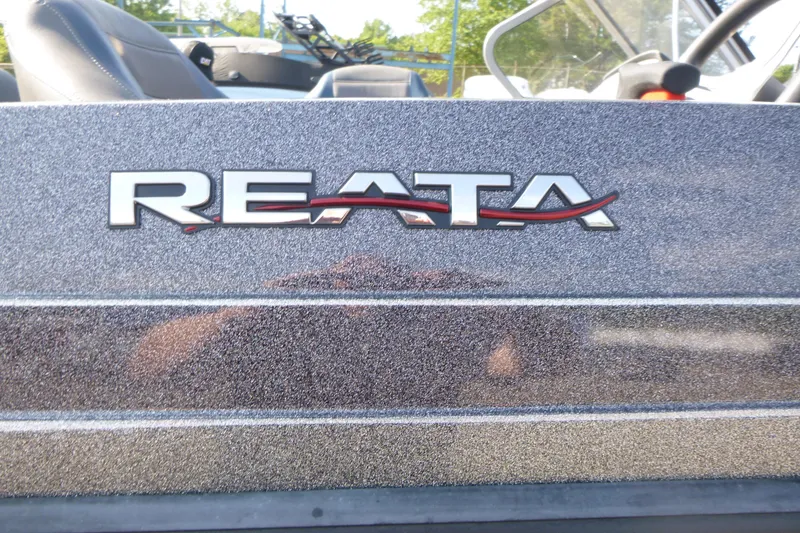 Slide: The Image of 2024 Ranger 212LS Reata boat logo on metallic finish. - 13