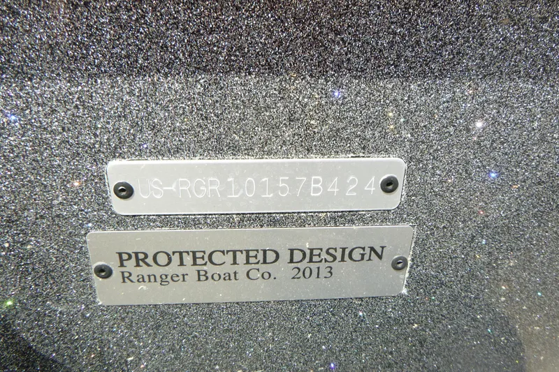 Slide: The Image of 2024 Ranger 212LS boat with protected design plates, serial number visible. - 14