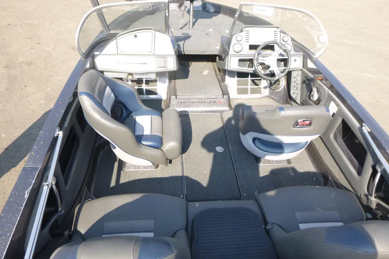 Slide: The Image of 2024 Ranger 212LS boat interior with dual seating and modern dashboard. - 5