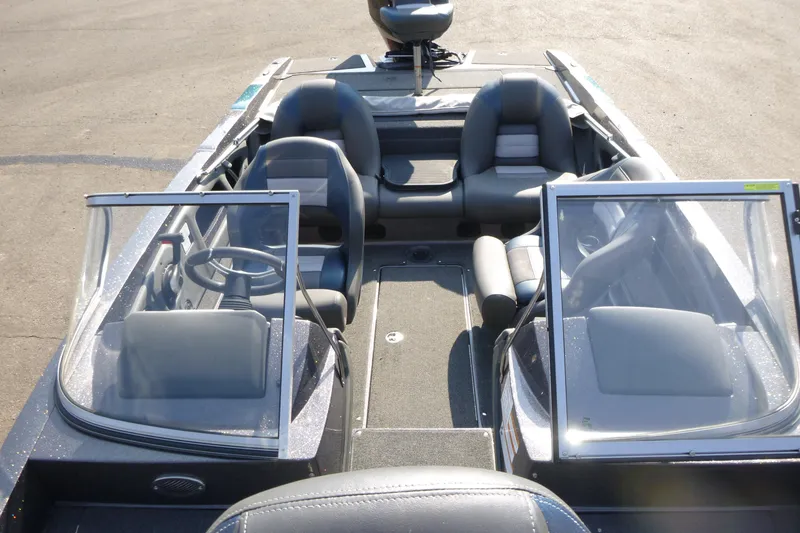 Slide: The Image of 2024 Ranger 212LS boat interior with dual consoles and seating. - 6