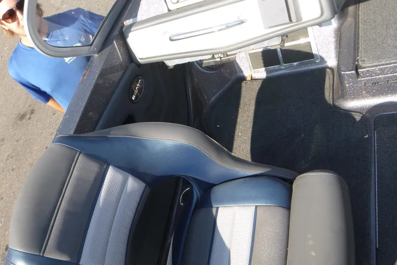 Slide: The Image of 2024 Ranger 212LS boat interior with gray and blue seating. - 9