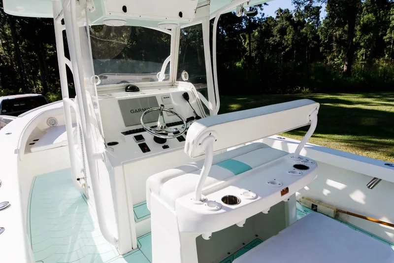 Slide: The Image of 2017 Albury Brothers center console boat interior with steering wheel and seating. - 10