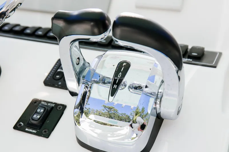 Slide: The Image of Close-up of 2017 Albury Brothers center console throttle controls. - 15