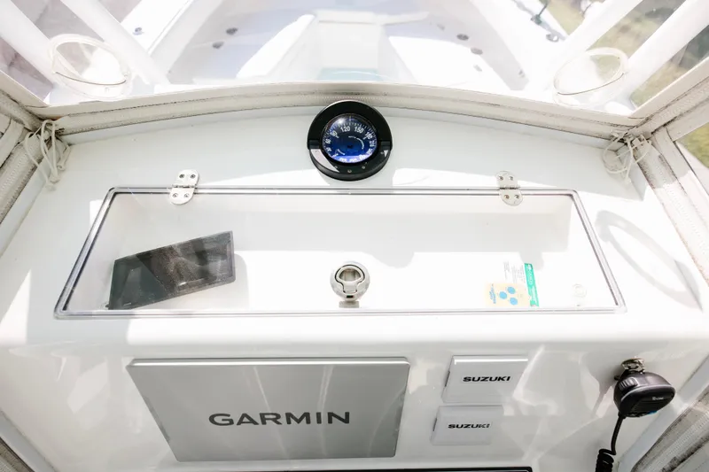 Slide: The Image of 2017 Albury Brothers center console with Garmin and Suzuki controls. - 17