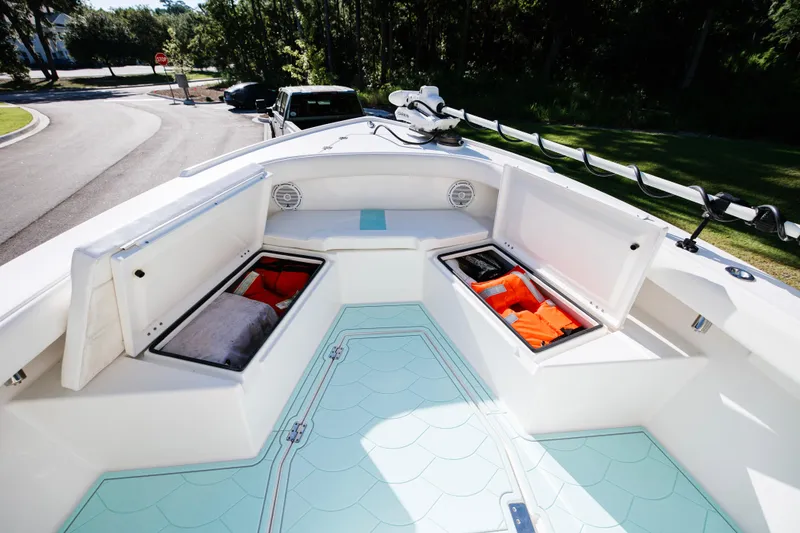 Slide: The Image of 2017 Albury Brothers center console boat with open storage compartments and safety gear. - 26