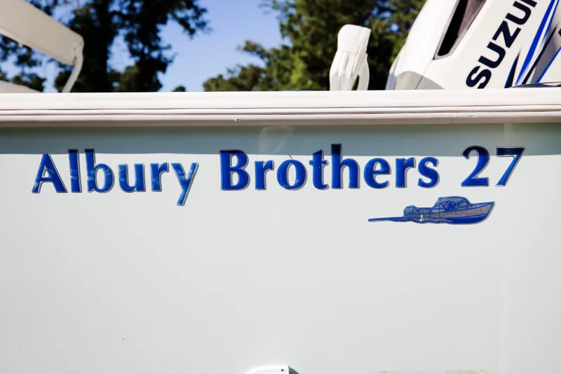 Slide: The Image of 2017 Albury Brothers 27 center console boat with Suzuki engine, side view. - 3