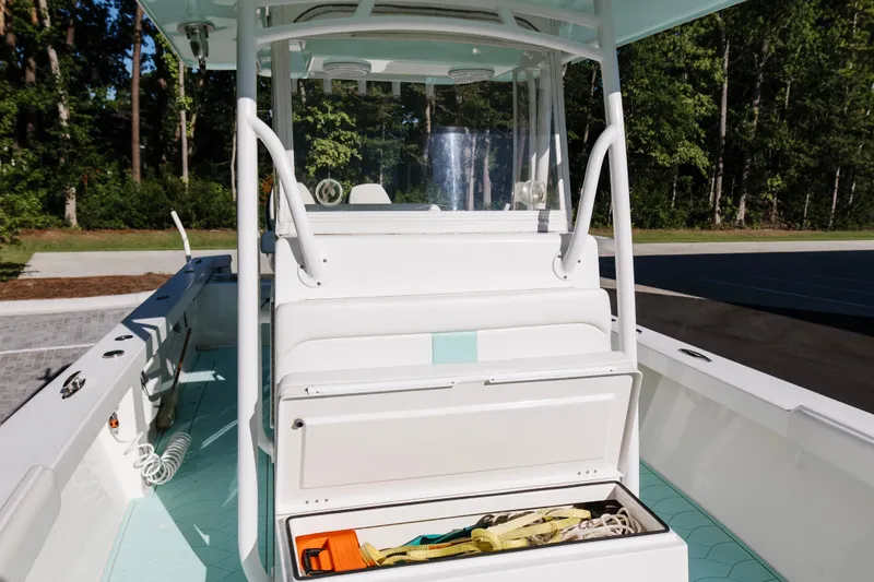 Slide: The Image of 2017 Albury Brothers center console boat with open storage compartment, docked outdoors. - 30