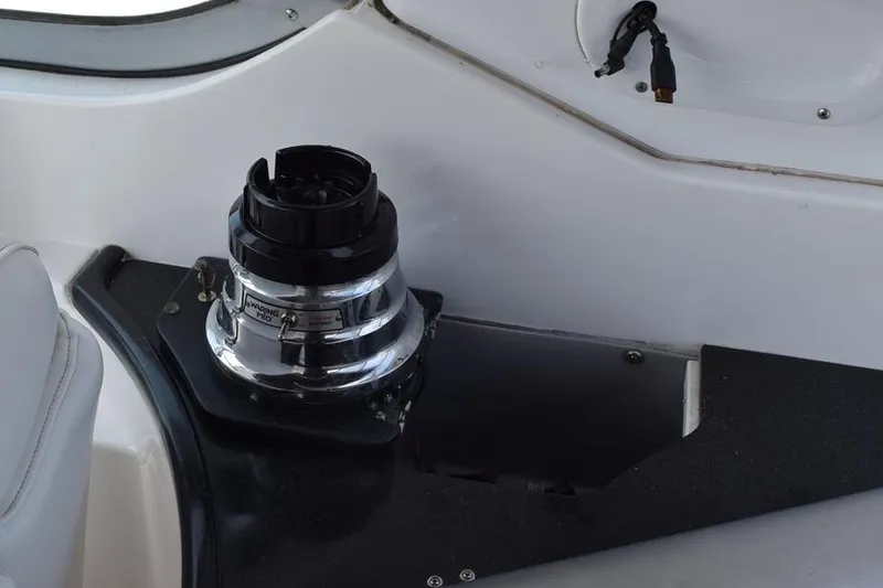 Slide: The Image of 2010 Rinker 310 Express Cruiser winch detail on deck. - 23