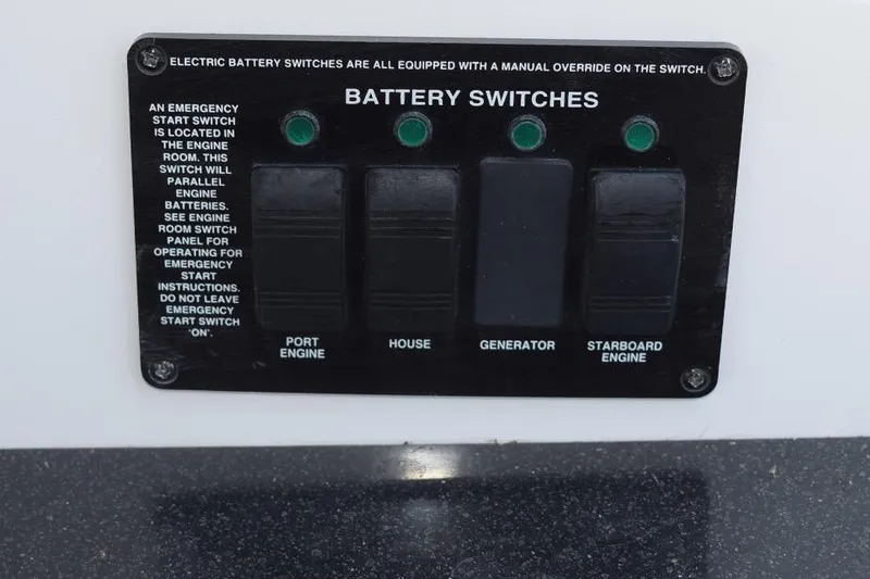 Slide: The Image of Battery switches panel on 2010 Rinker 310 Express Cruiser boat. - 24