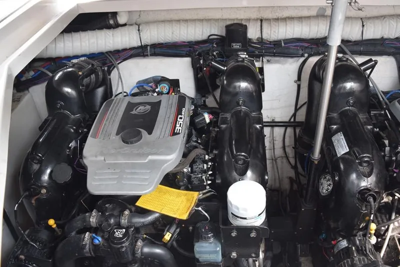 Slide: The Image of Engine compartment of a 2010 Rinker 310 Express Cruiser with dual 350 MAG engines. - 44