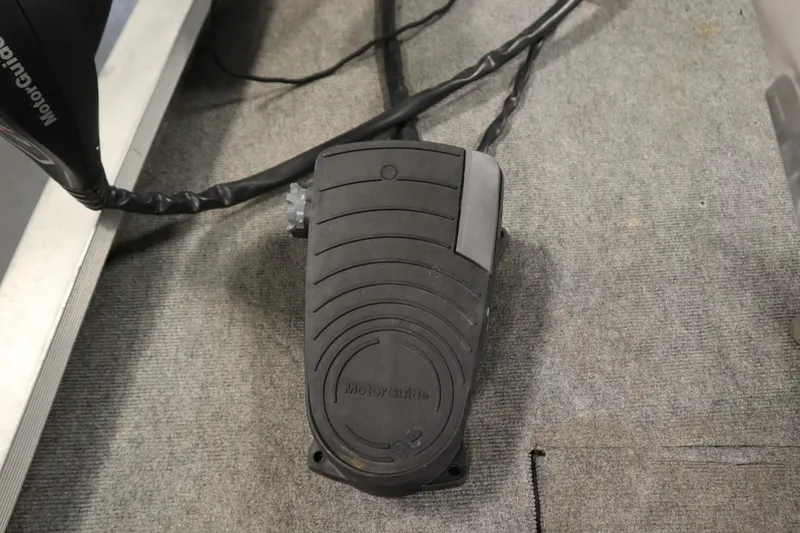 Slide: The Image of Foot pedal control on 1997 Tracker 18 Pro Team SC boat, featuring MotorGuide branding. - 12