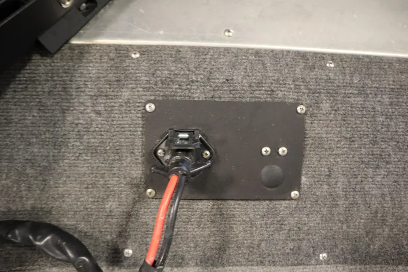 Slide: The Image of 1997 Tracker 18 Pro Team SC boat electrical connection on carpeted surface. - 14