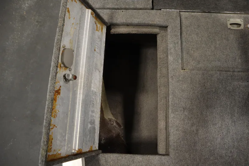 Slide: The Image of Open storage compartment in 1997 Tracker 18 Pro Team SC boat. - 17