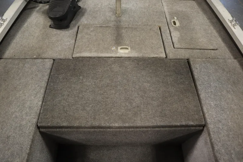 Slide: The Image of 1997 Tracker 18 Pro Team SC boat interior with carpeted storage compartments. - 20